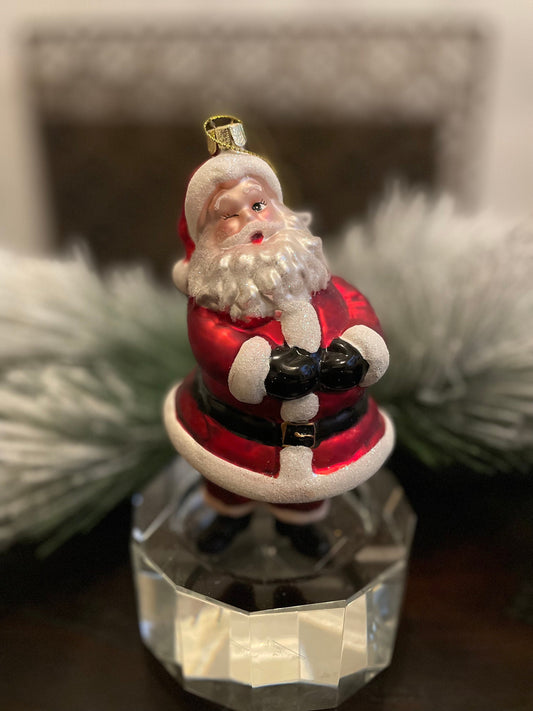 6" glass wink santa ornament.