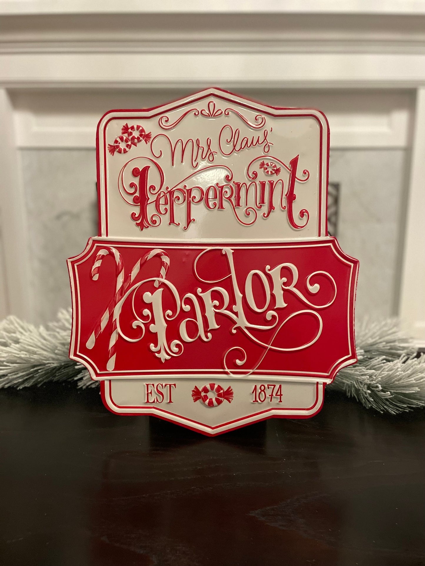 21.75” Peppermint parlor embossed metal wall art.