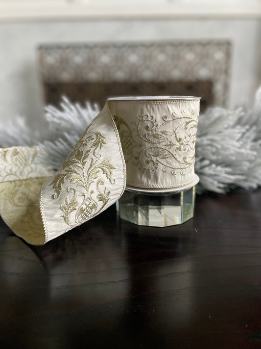 4” x 5 yds. Designer ivory and gold damask embroidered dupion ribbon. Wired. Regency.