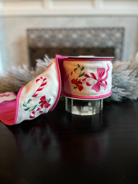 4” x 5 yds. Designer candy cane and bow embroidered wool felt ribbon. Pink and cream. Wired. Regency.
