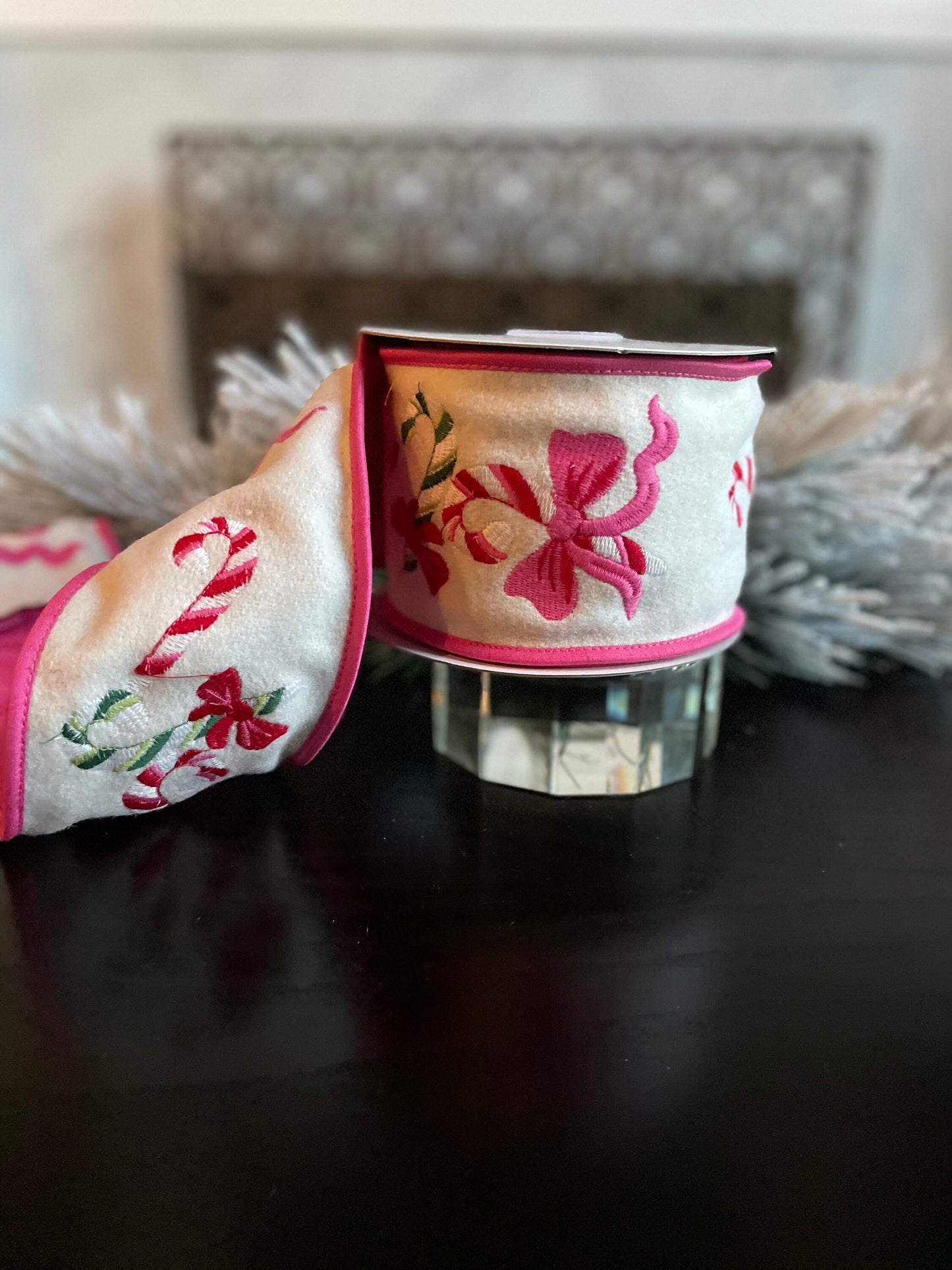4” x 5 yds. Designer candy cane and bow embroidered wool felt ribbon. Pink and cream. Wired. Regency.