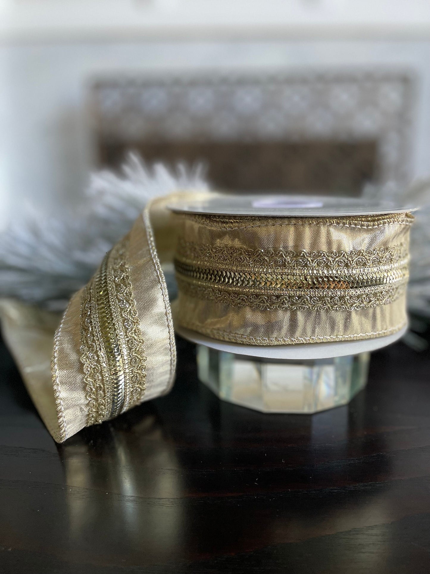 2.5” x 10 yds. Designer embellished gold lame wired ribbon. Raz.