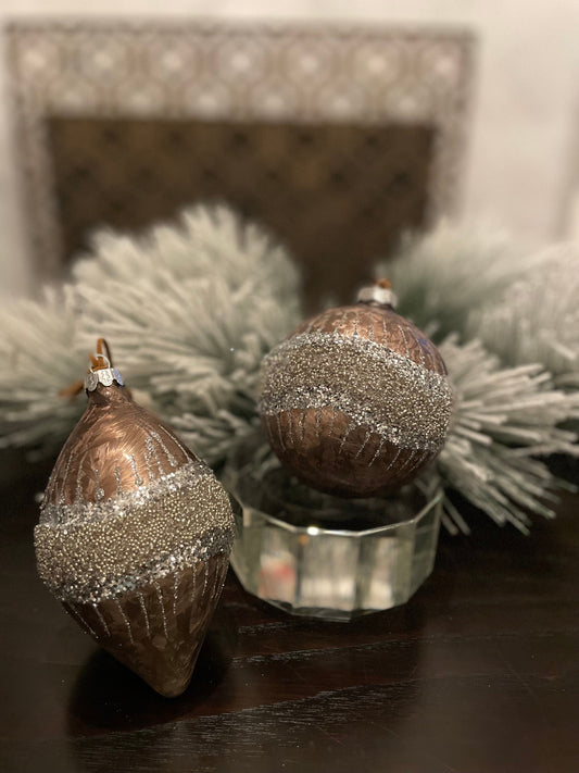 Set of 2. 4”-6” Glass frosted glitter wave ball and kismet.