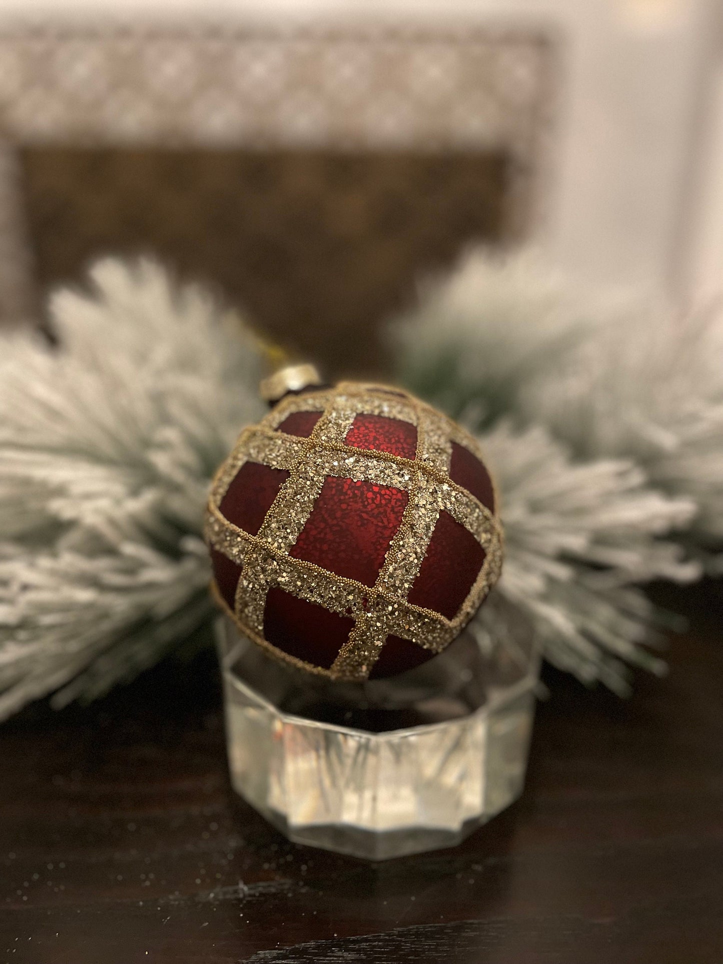 Set of 2. 4” glass gilded cranberry ball ornament.