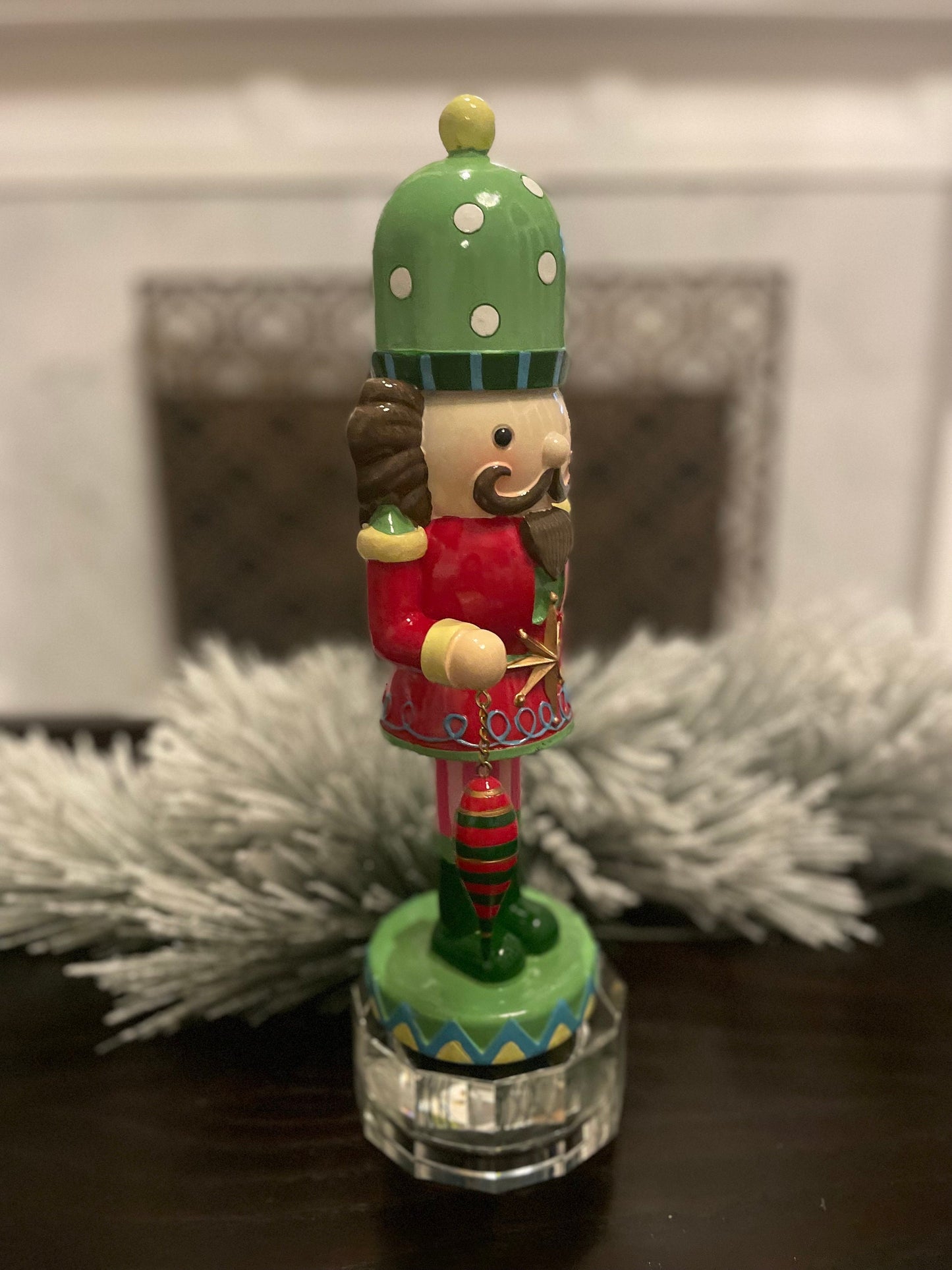 14” Resin nutcracker with ornament. Tabletop.