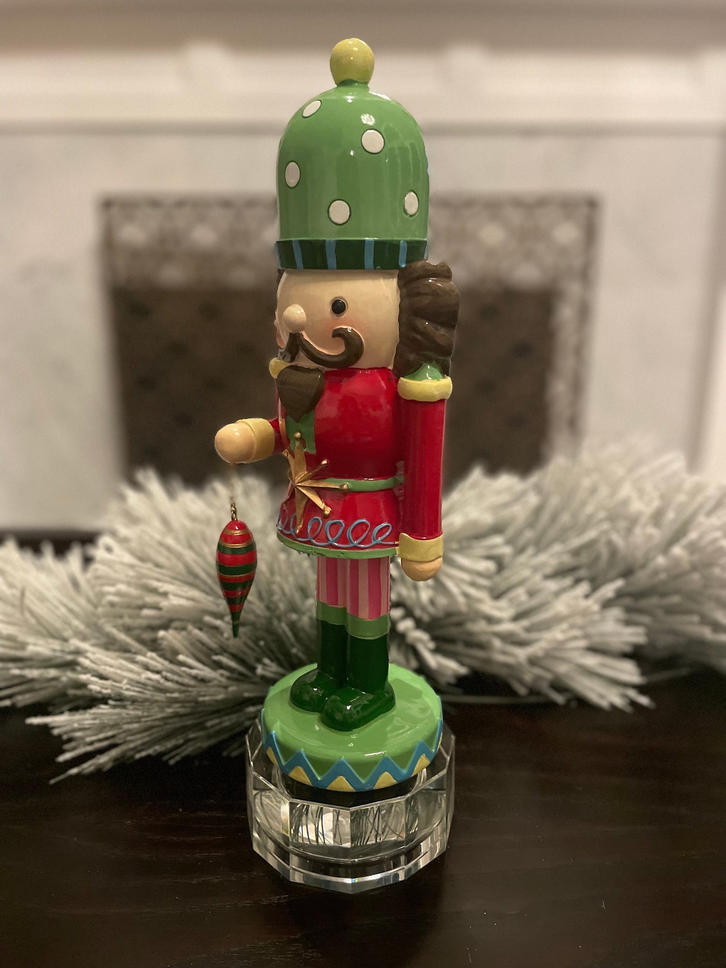 14” Resin nutcracker with ornament. Tabletop.