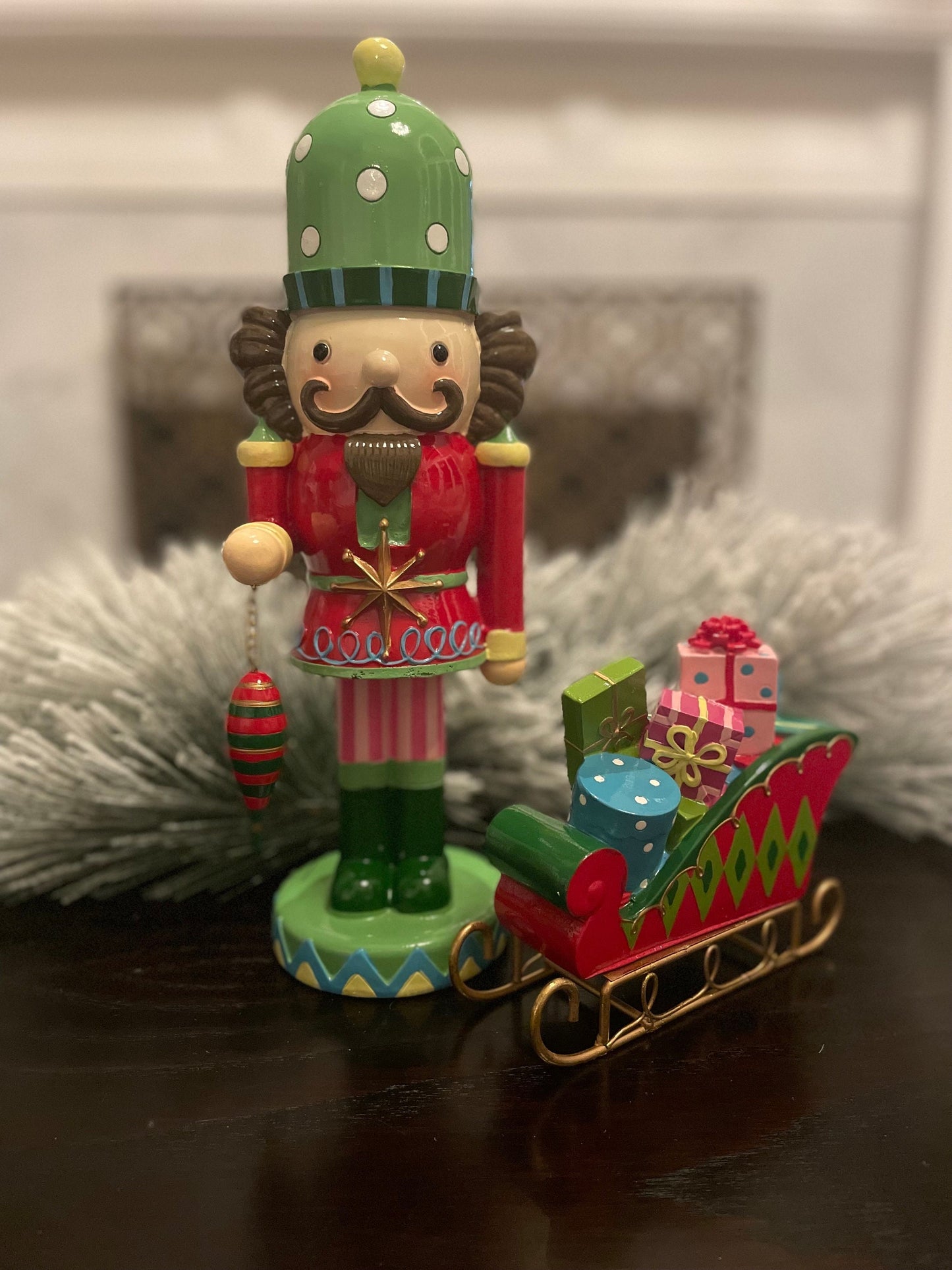 14” Resin nutcracker with ornament. Tabletop.