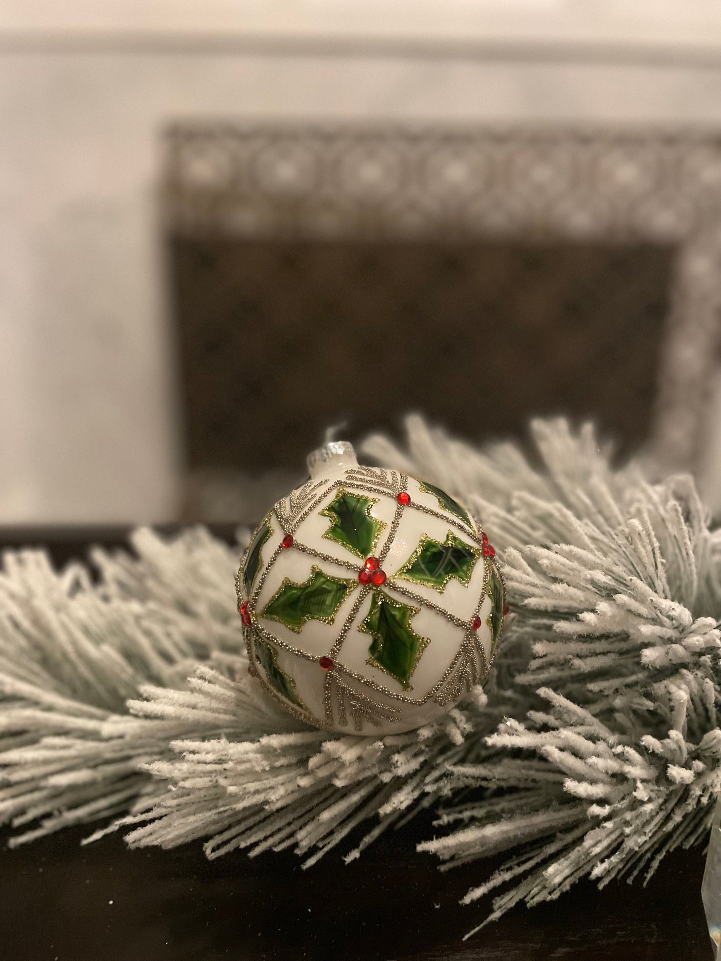 Set of 2. 4" glass holly jewel ball ornament.