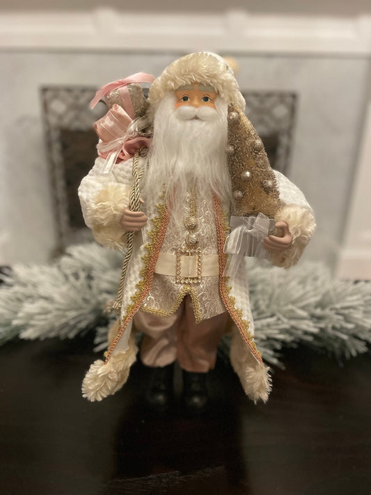 19" Santa holding a tree. Pink, ivory and gold.