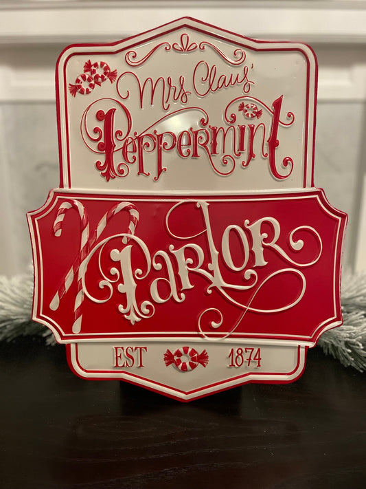 21.75” Peppermint parlor embossed metal wall art.