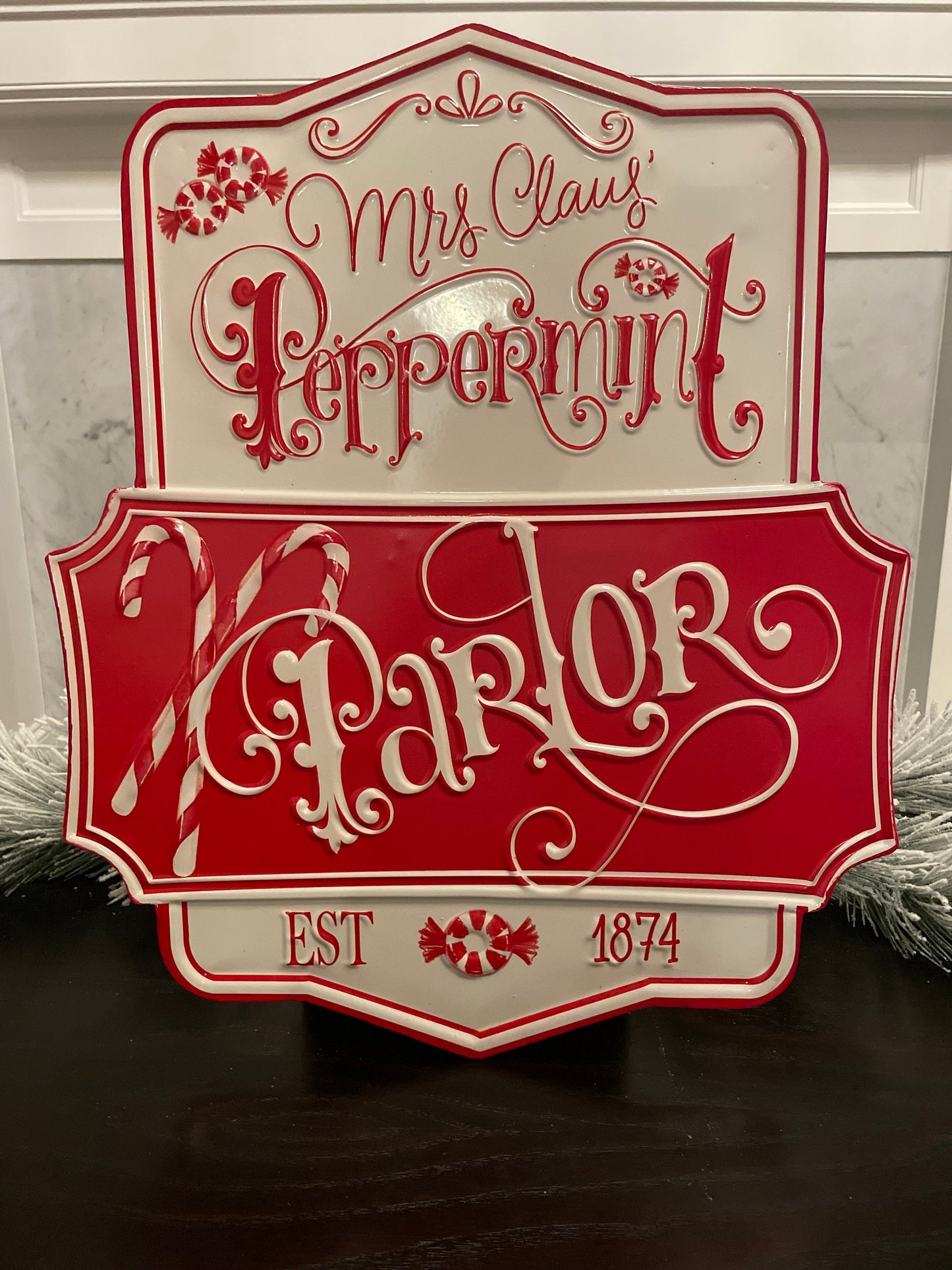 21.75” Peppermint parlor embossed metal wall art.