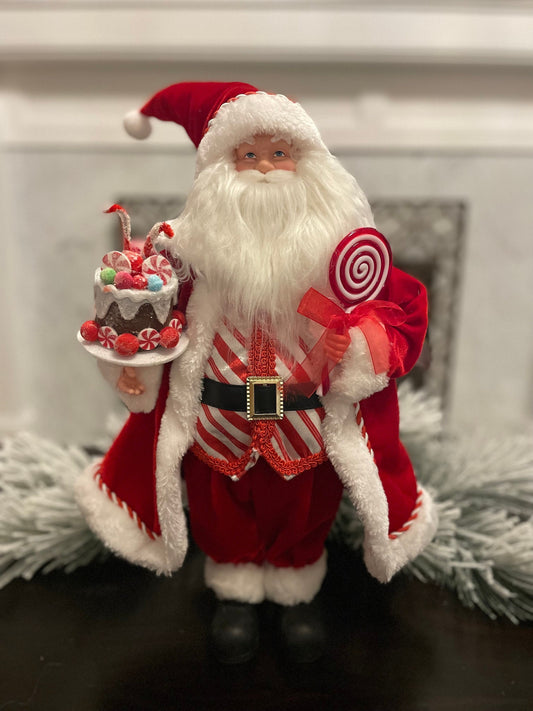19” Merrymint Santa. Santa holding a cake.
