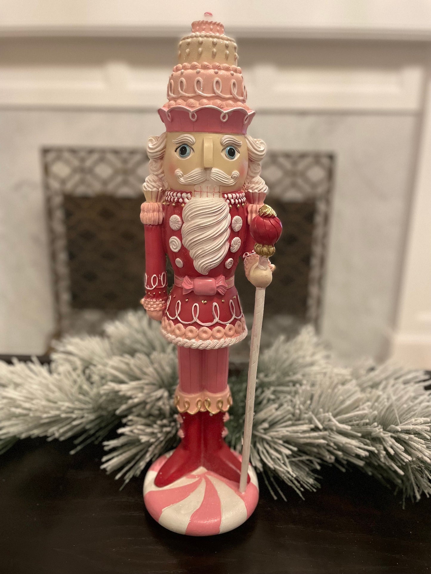 18.75” Nutcracker with cake resin pink peppermint. Sweet nutcracker!