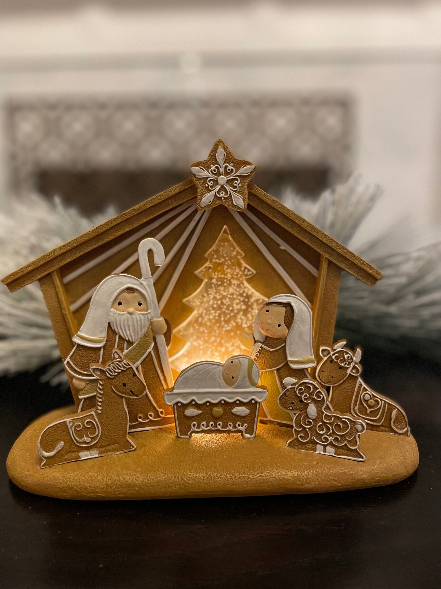 7.5”H x 8”L x 4”W. Nativity Gingerbread lighted. Manger scene.