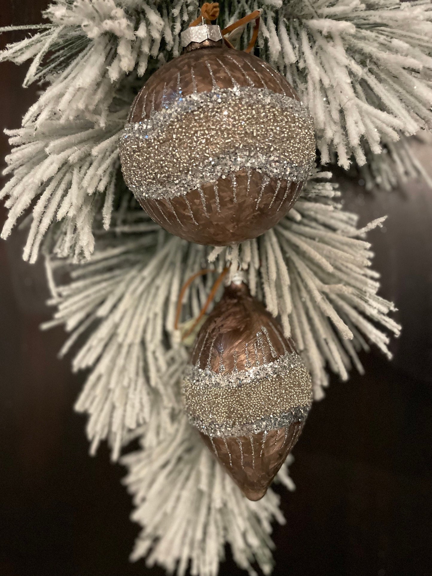 Set of 2. 4”-6” Glass frosted glitter wave ball and kismet.