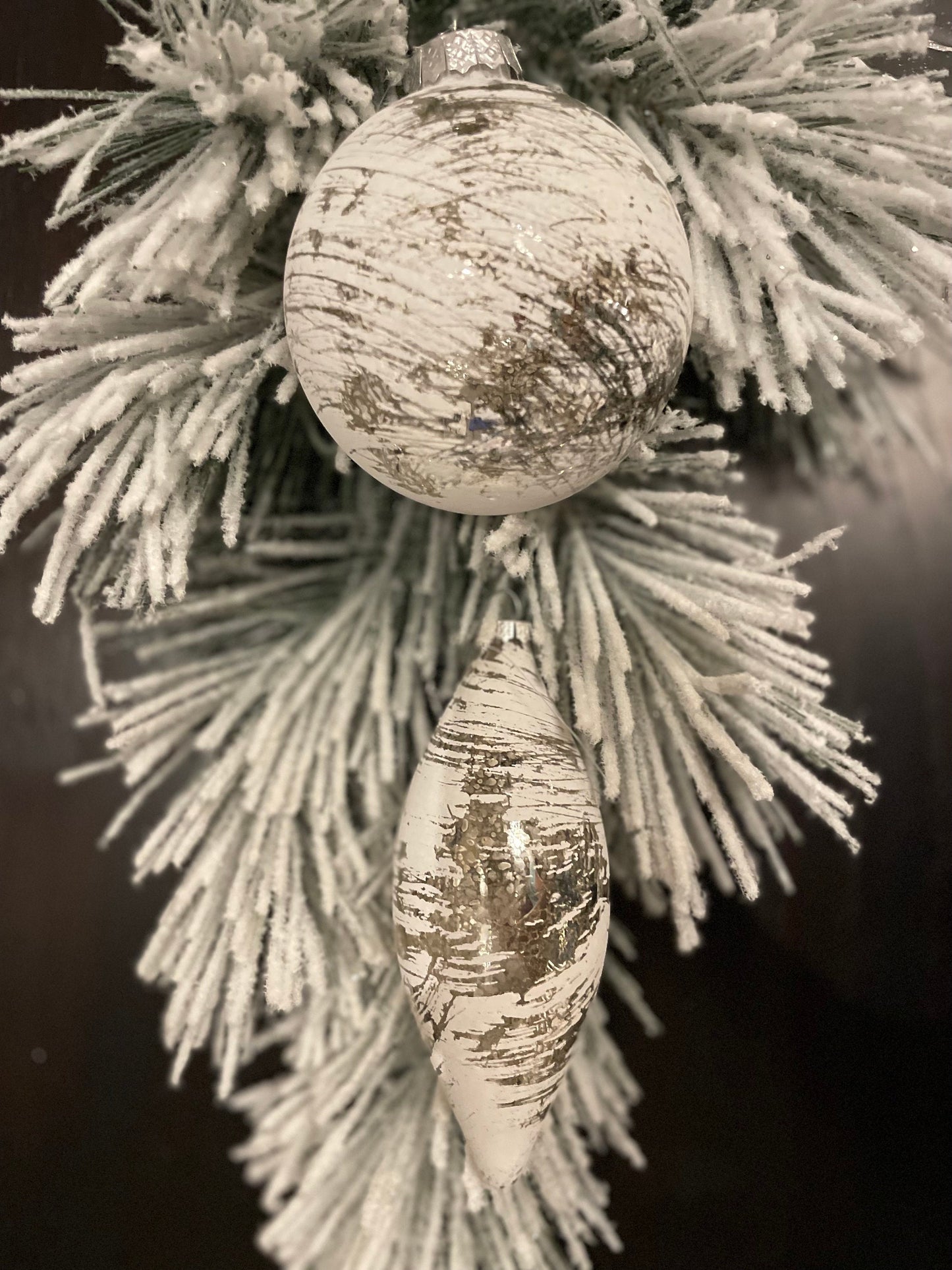 Set of 2. 4”-6” glass whitewash mercury ball and finial.