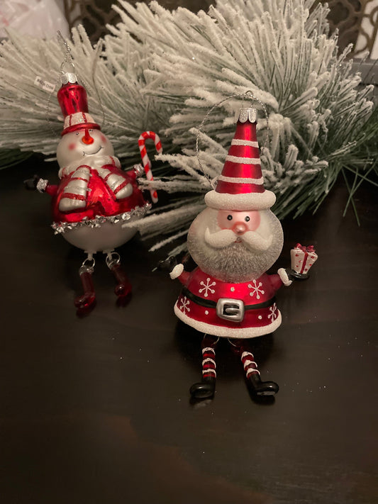 6.25” Santa and snowman glass ornaments.