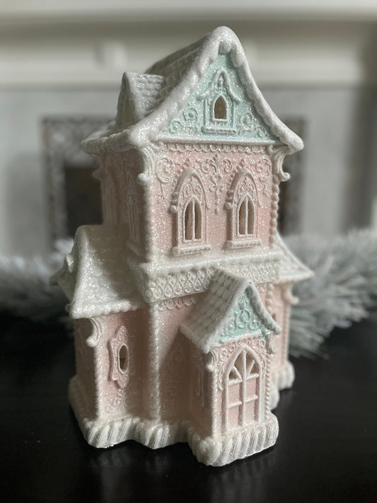 14”H x 9.5”W x 8” D. Gingerbread lighted house. Pink and blue.