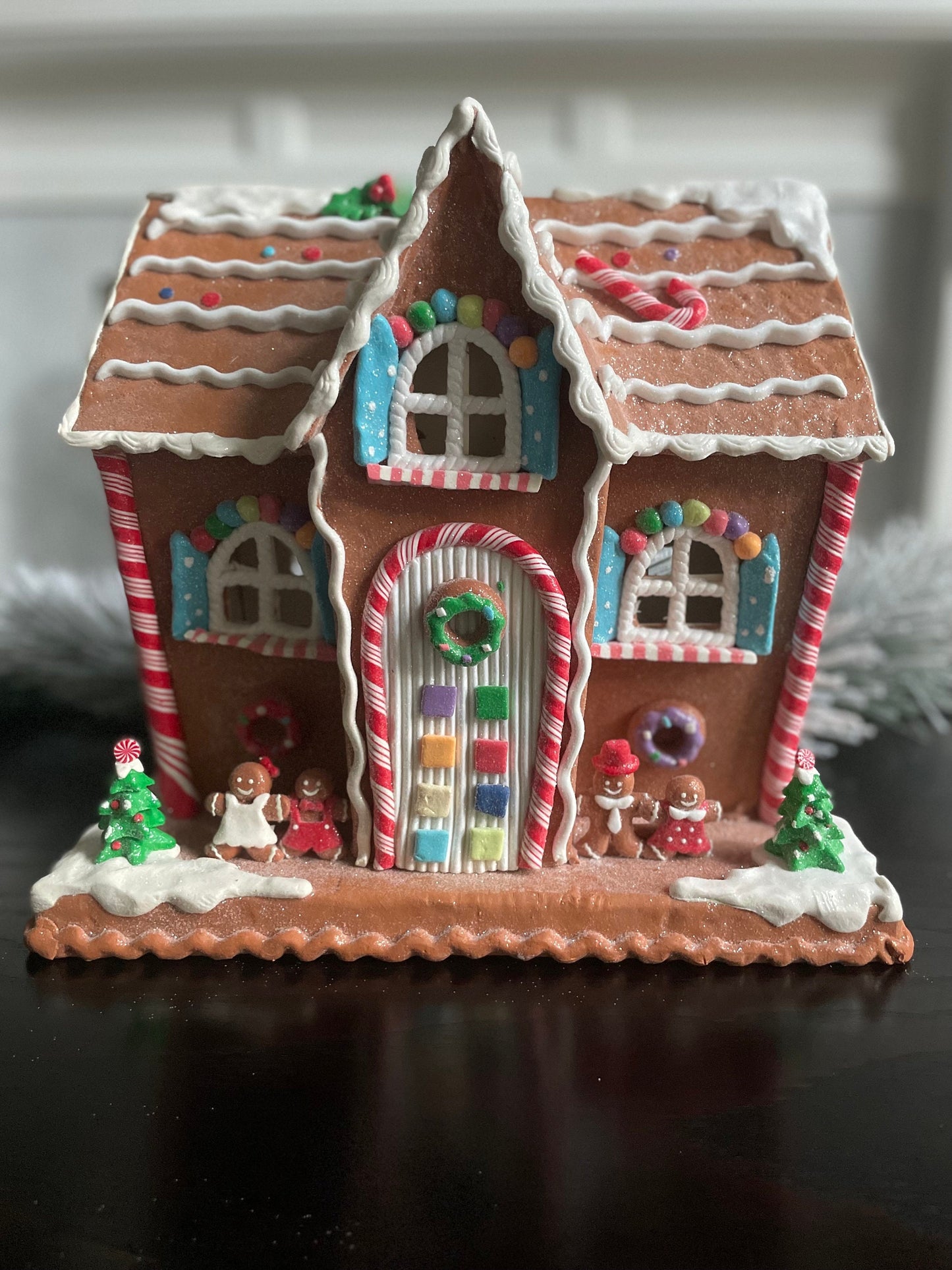 12"H x 13” W x 9” D. Lighted gingerbread house. Multicolor.