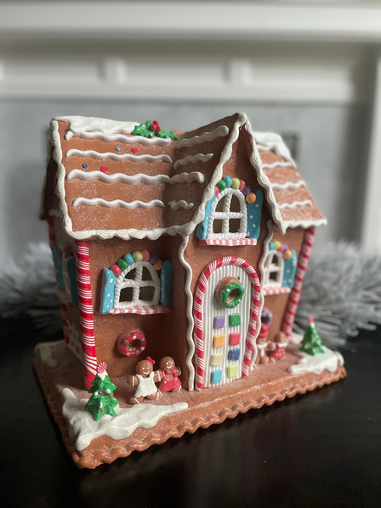 12"H x 13” W x 9” D. Lighted gingerbread house. Multicolor.