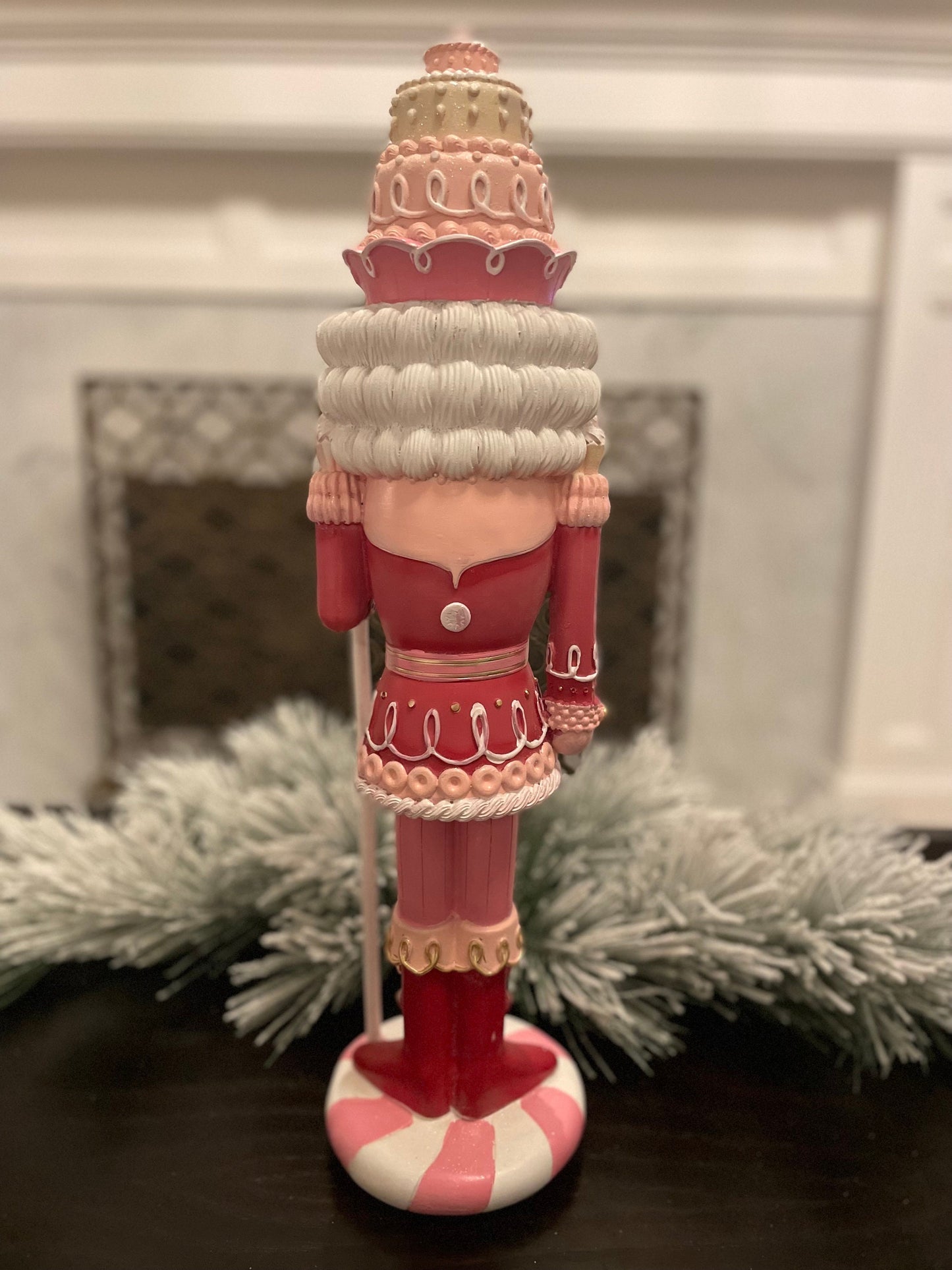 18.75” Nutcracker with cake resin pink peppermint. Sweet nutcracker!