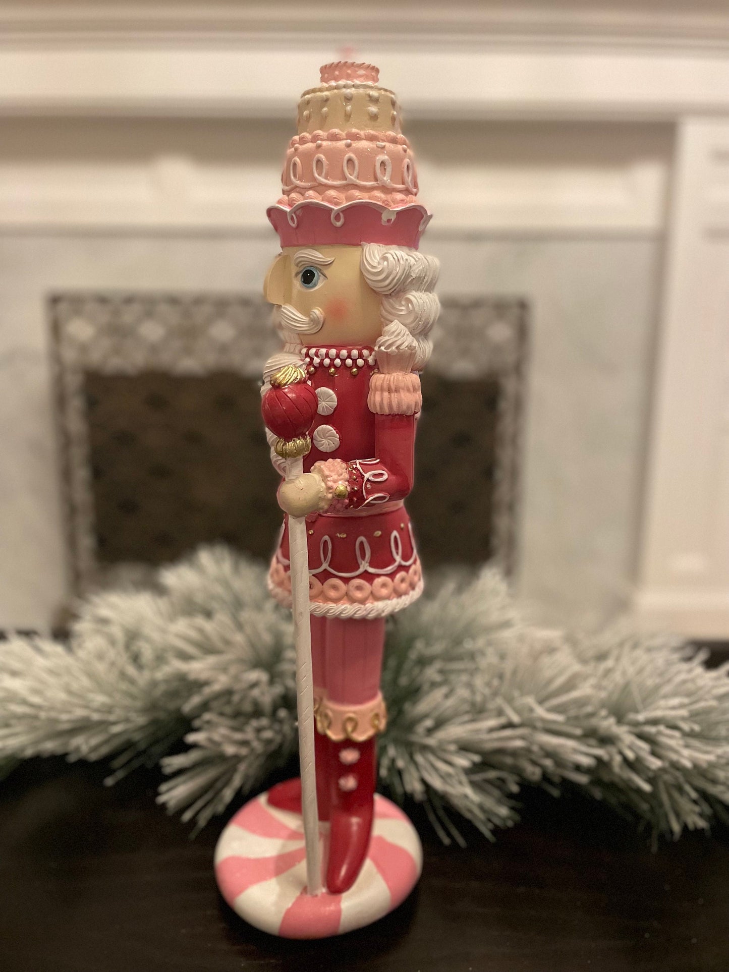 18.75” Nutcracker with cake resin pink peppermint. Sweet nutcracker!