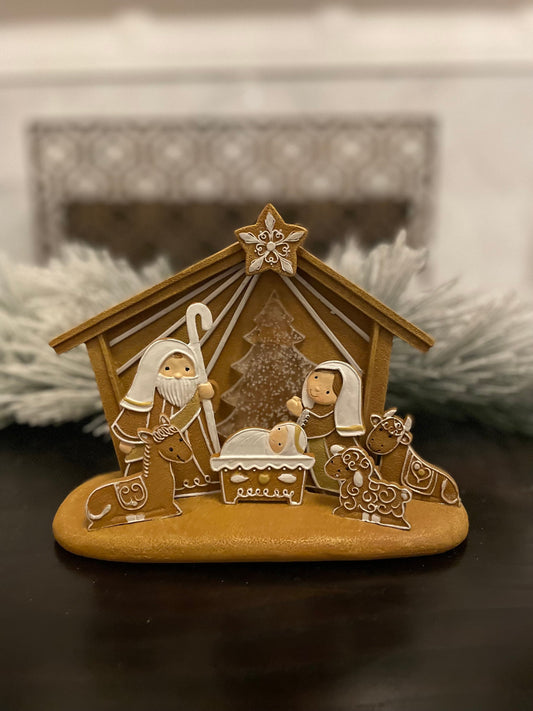 7.5”H x 8”L x 4”W. Nativity Gingerbread lighted. Manger scene.