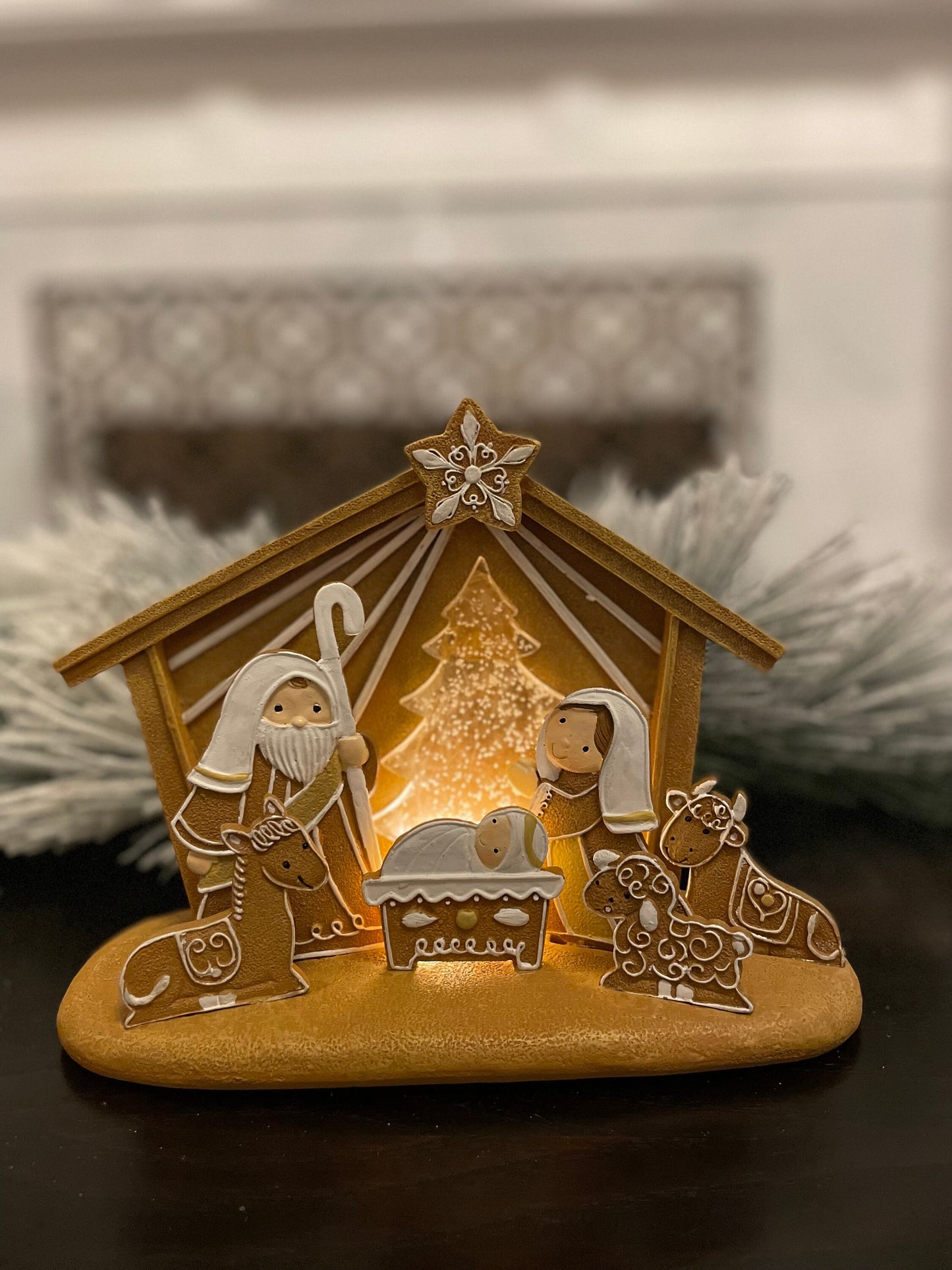 7.5”H x 8”L x 4”W. Nativity Gingerbread lighted. Manger scene.