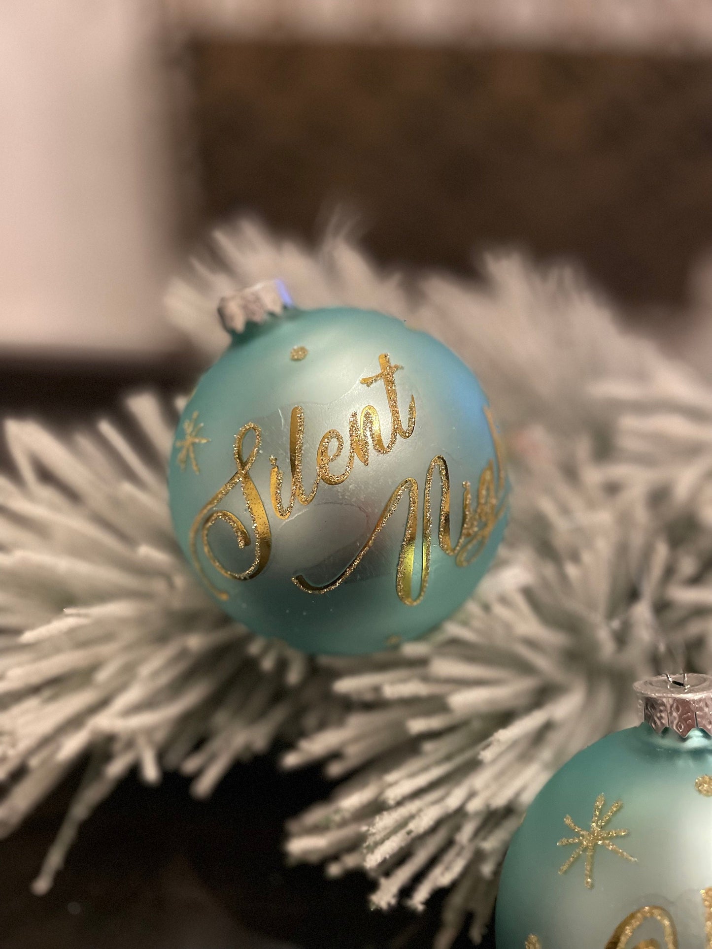 Set of 2. 4” aqua gold silent night and holly night glass ball ornaments. Set of 2.