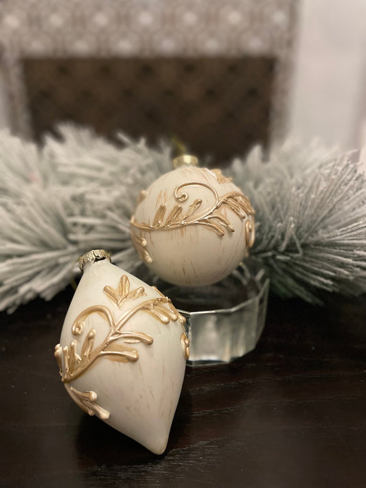 Set of 2. 4”-5” glass and resin acanthus ball and finial ornament.